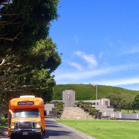 a passenger bus that is parked on the side of a road