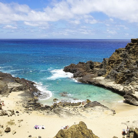 a rocky beach next to the ocean