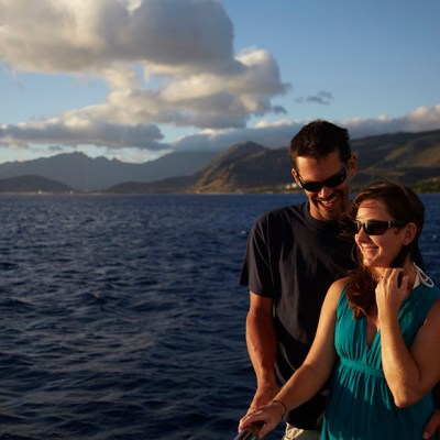 couple on deck sunset cruise