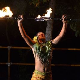 a person standing in front of a fire