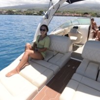 a person sitting on a boat in a body of water