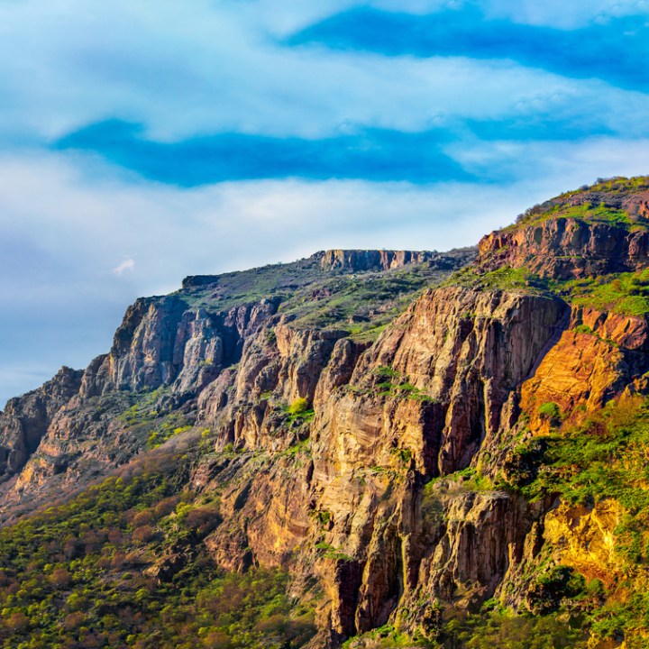 a canyon with a mountain in the background