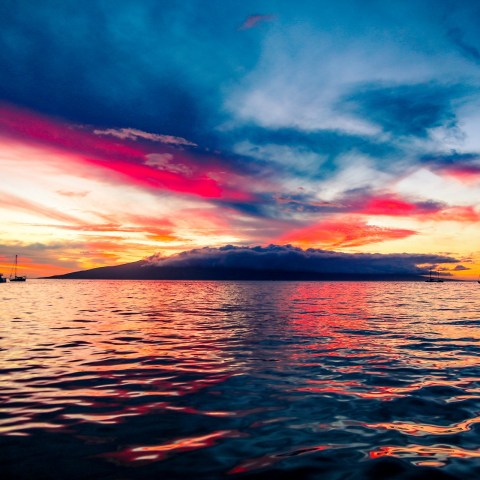 a sunset over a body of water