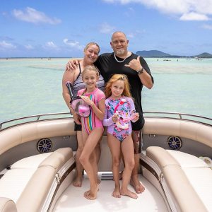 a woman sitting on a boat in a body of water