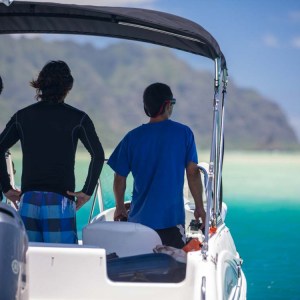 a man driving a boat in the water