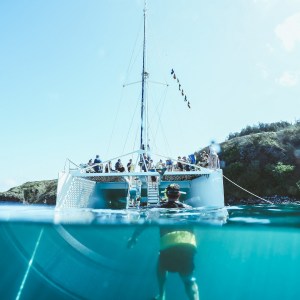 a man riding on the back of a boat