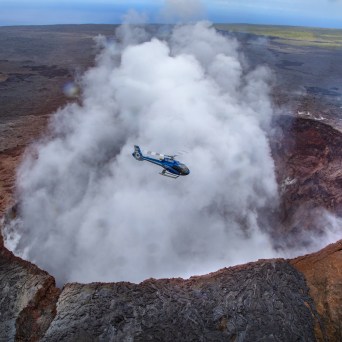 a steam train is coming down the mountain