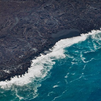 a man riding a wave on top of a body of water