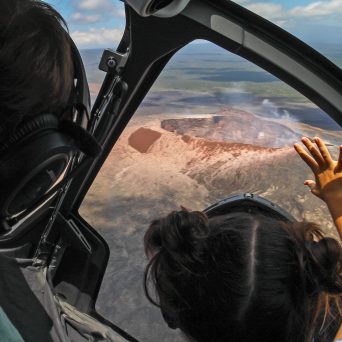 a person sitting on the seat of a car