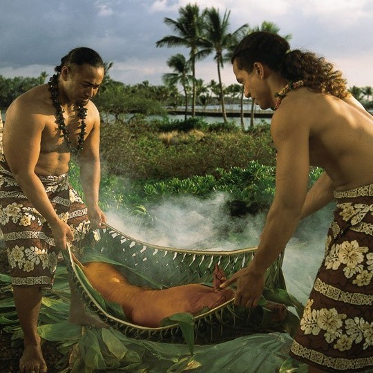 a couple of people that are standing in the water