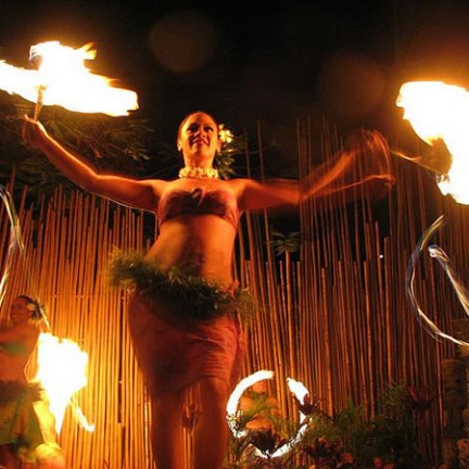 a person standing in front of a fire