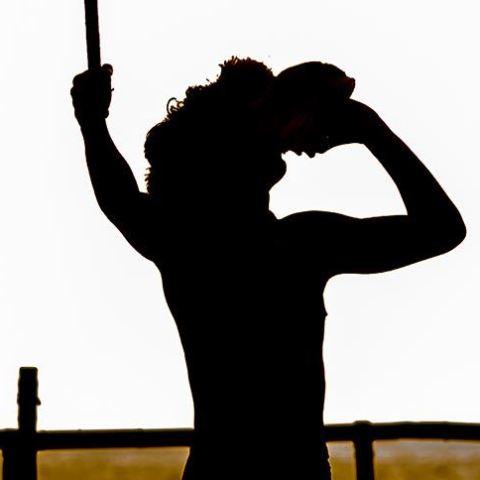 a person with a sunset in the background