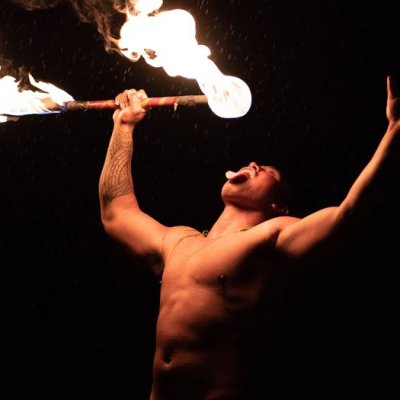 a person standing in front of a fire