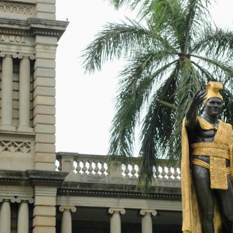 a statue in front of a building