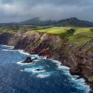 a body of water with a mountain in the background
