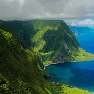a body of water with a mountain in the background