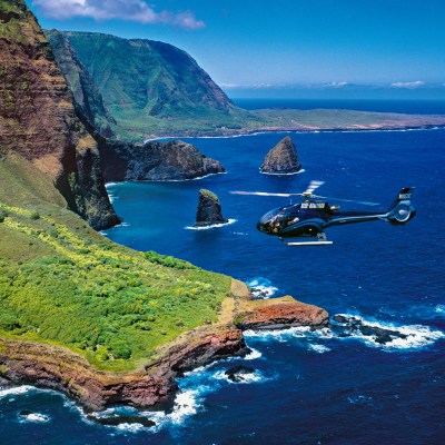 a body of water with a mountain in the background