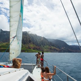 a group of people in a boat on a body of water