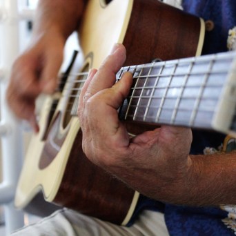 a man holding a guitar