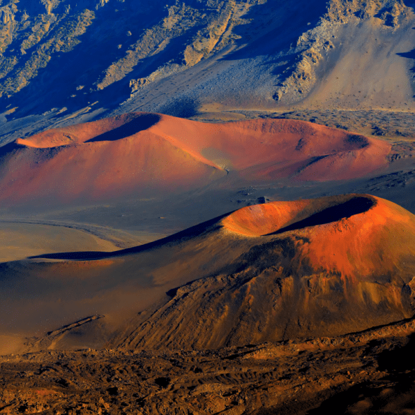 a sunset over a snow covered mountain
