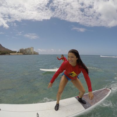 a person riding a surf board on a body of water