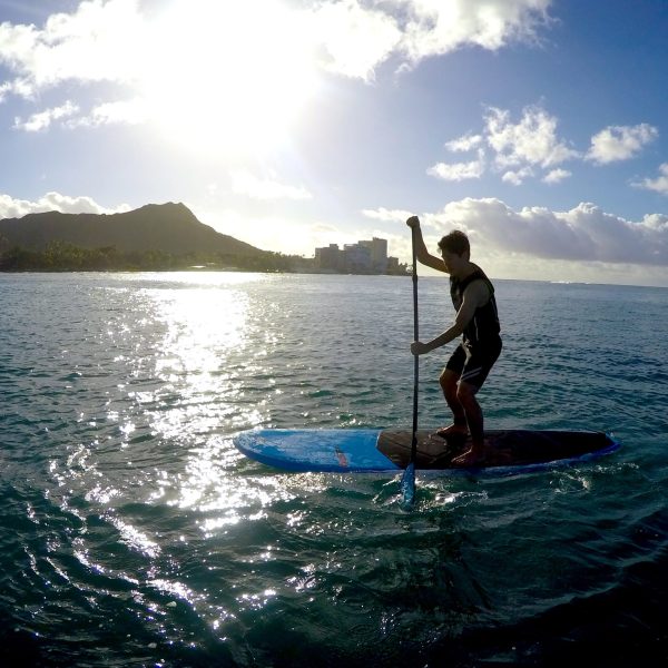 a person riding a surf board on a body of water