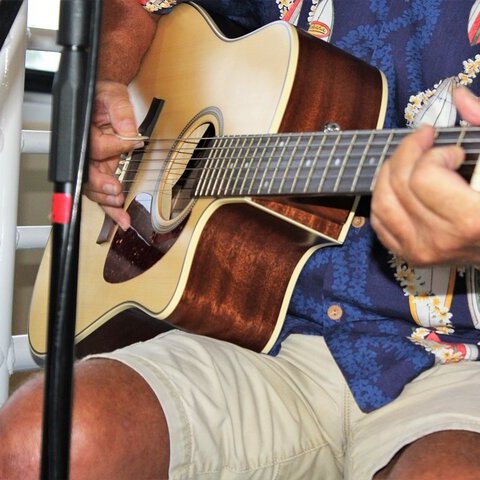 a person holding a guitar