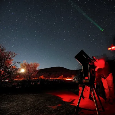 a traffic light is lit up at night