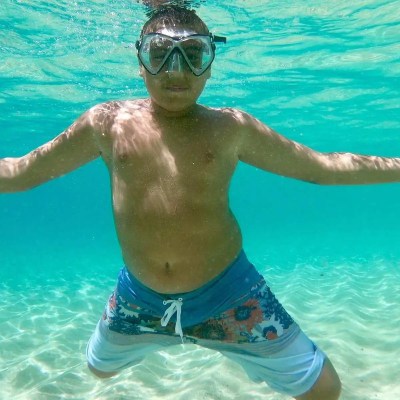 kid underwater snorkeling