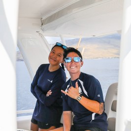 a person sitting on a boat in the water