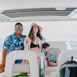 a couple of people that are sitting on a boat in the water