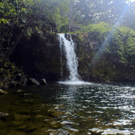 a large waterfall over a body of water