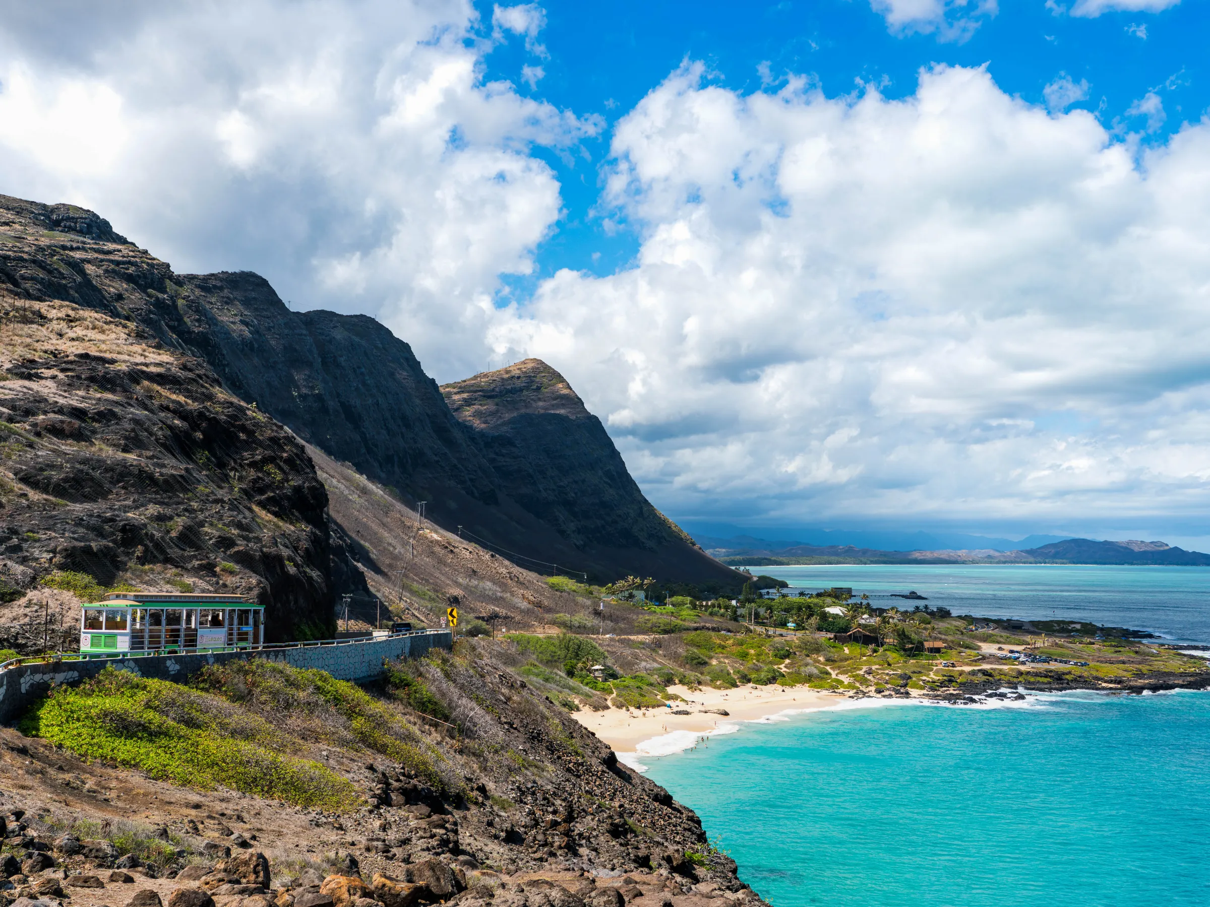 a body of water with a mountain in the background