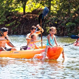 a group of people riding on the back of a boat