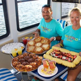 a person sitting at a table with a plate of food