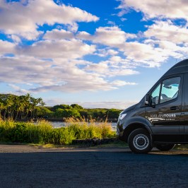 a car parked on the black sand beach