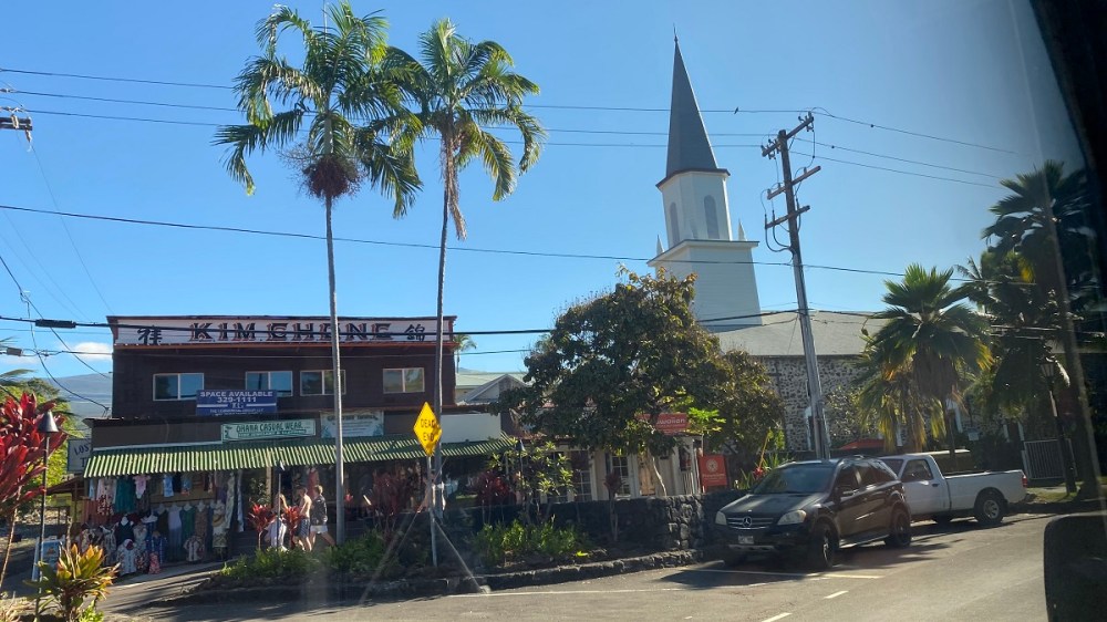 a train is parked on the side of a building