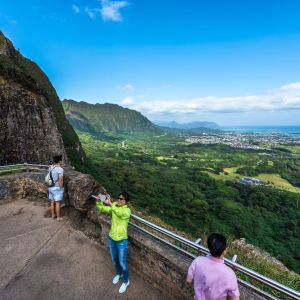 a group of people standing on top of a mountain