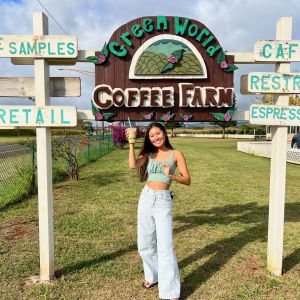 a person standing in front of a sign