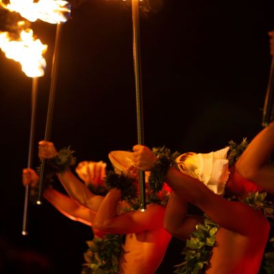 a person standing in front of a fire