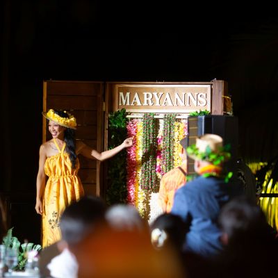 a group of stuffed animals sitting next to a fireplace
