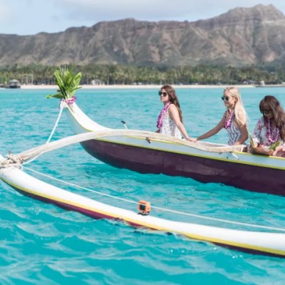 a group of people in a boat on a body of water