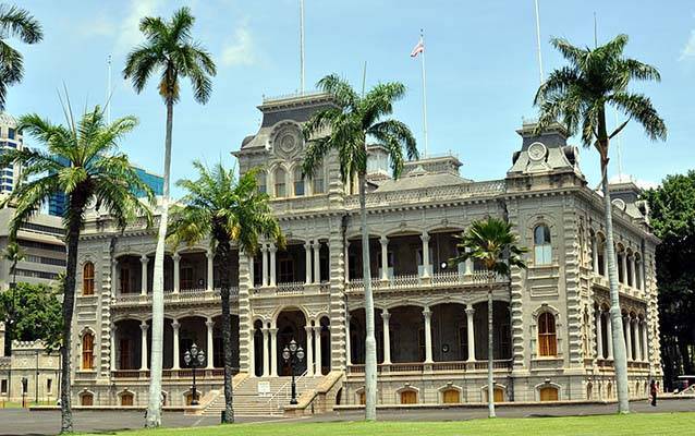 Historic palace with palm trees and ornate architecture